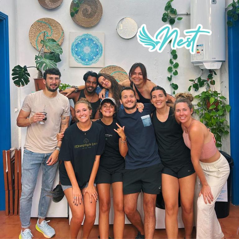 a group of people posing for a picture at Ashavana Nest Hostel in El Médano