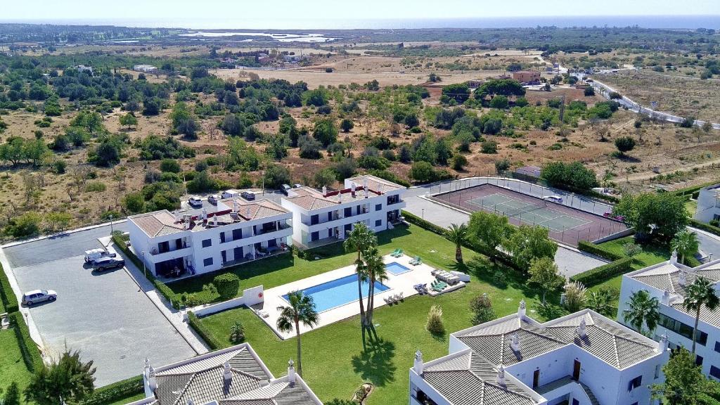 an aerial view of a mansion with a tennis court at Pêra Secret Garden 2 With Pool by Homing in Pêra