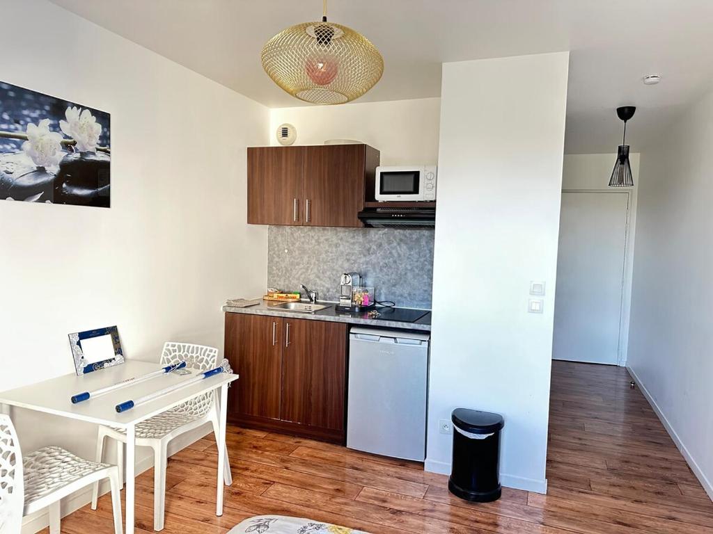 Køkken eller tekøkken på La Conciergerie des 4 Ailes