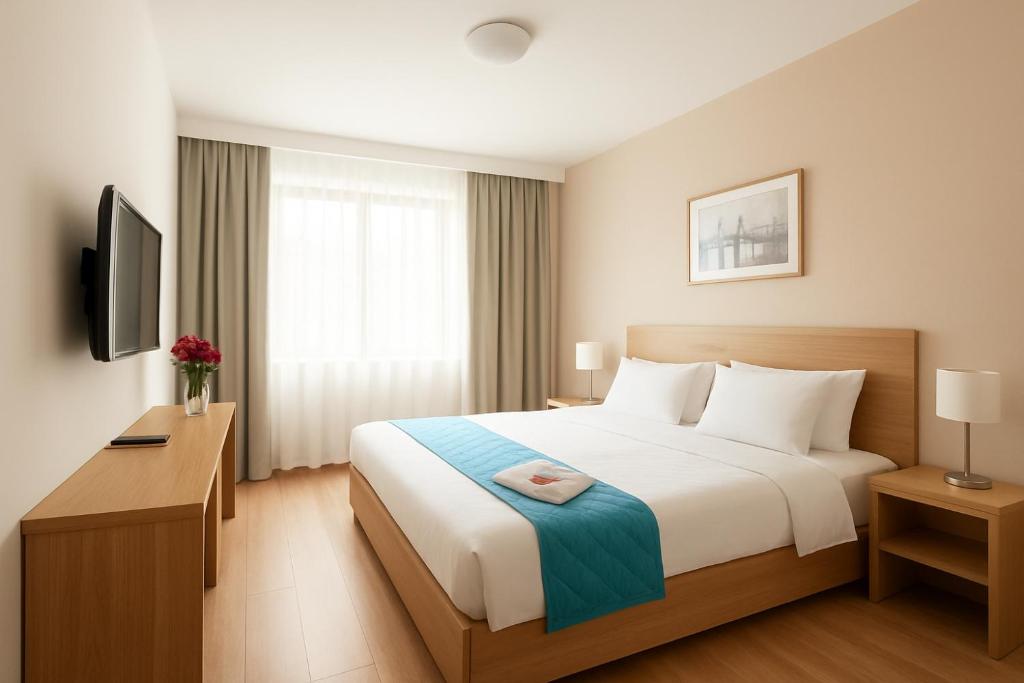 a hotel room with a bed and a television at Hotel The OIive Premium Near Gurudwara Guru Nanak Darbar- Valley Mountain View - Wifi - Room Service Available - A Premium Hotel In Darjeeling in Darjeeling