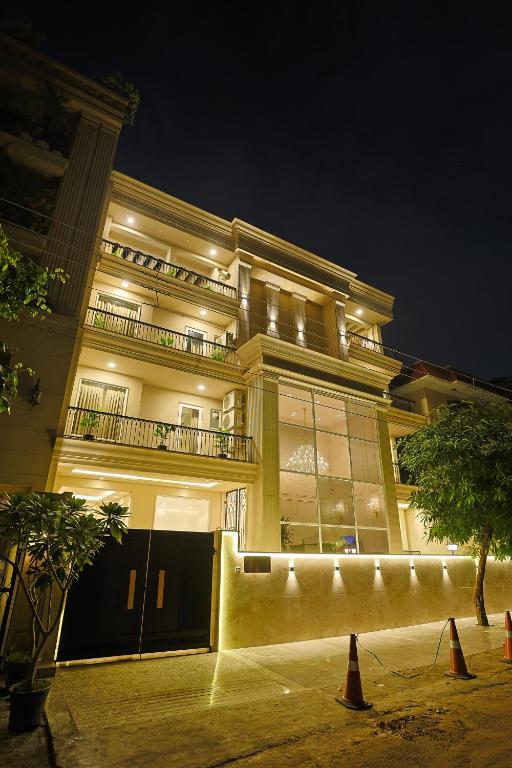 a large building with lights on the side of it at Millora Cyber Suites, DLF Phase 3 in Gurgaon