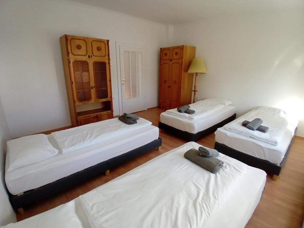 a room with three beds in a room at Bükfalva Bercsényi13 in Bük