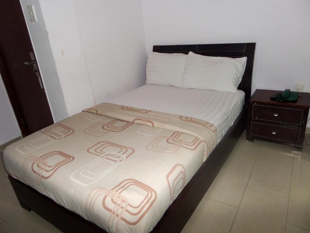Postel nebo postele na pokoji v ubytování TheoDawn Hotels @ Suite 29
