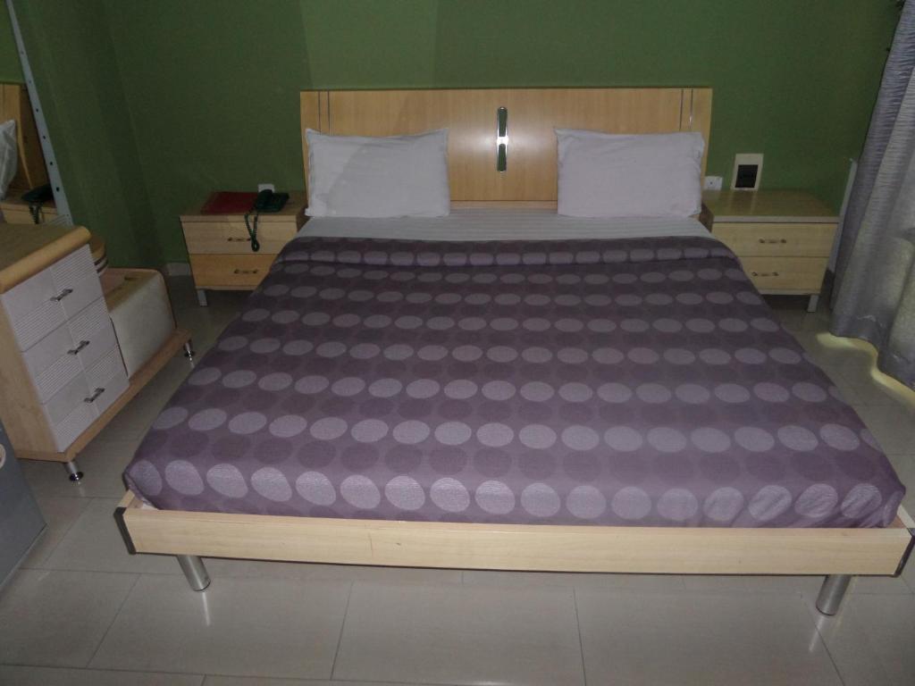 Postel nebo postele na pokoji v ubytování TheoDawn Hotels @ Suite 29