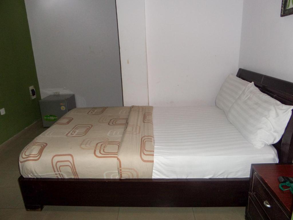 Postel nebo postele na pokoji v ubytování TheoDawn Hotels @ Suite 29