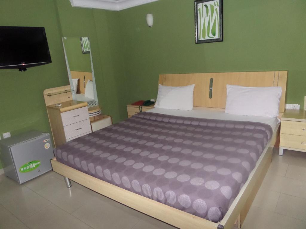 Postel nebo postele na pokoji v ubytování TheoDawn Hotels @ Suite 29