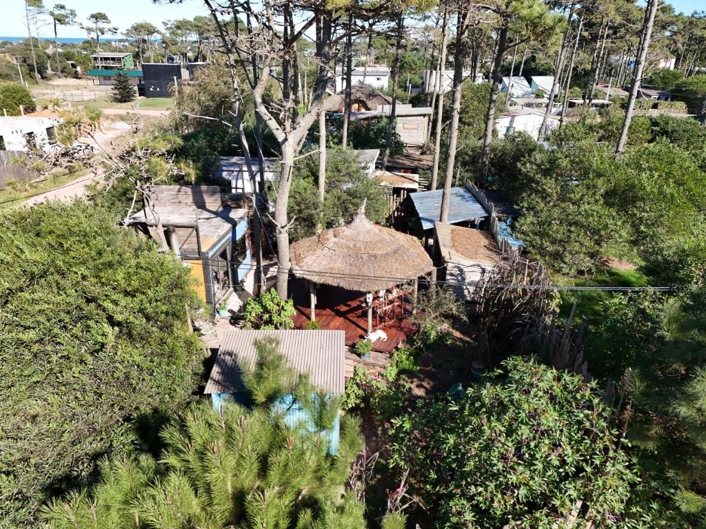 an aerial view of a house with a roof at Kosmik House in Punta Del Diablo