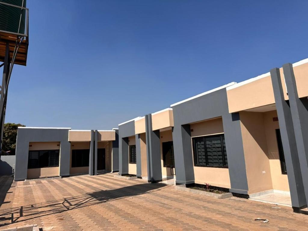 a building with a lot of windows and a blue sky at T & M Apartments in Ndola