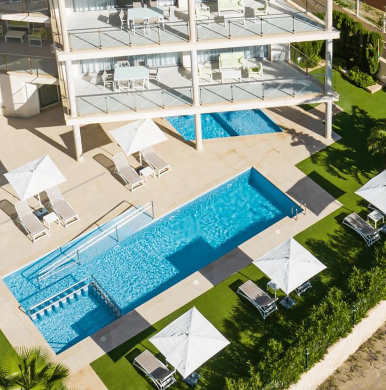an overhead view of the pool at a resort at Apartaments Posidonia in Colònia de Sant Jordi