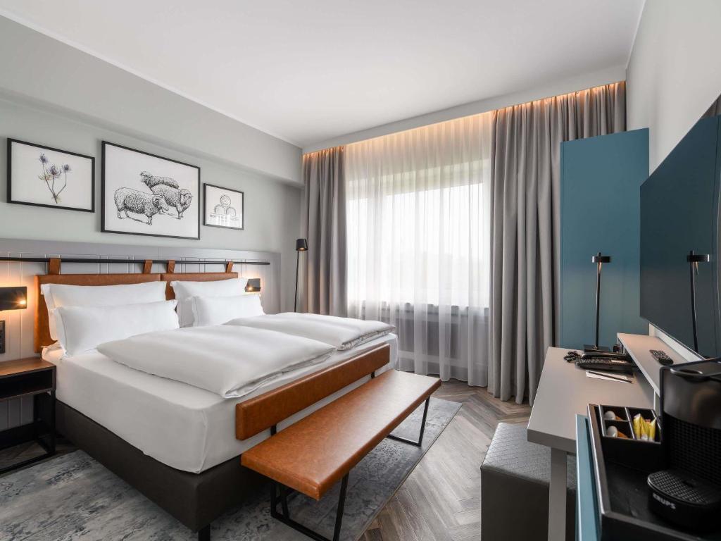 Ένα ή περισσότερα κρεβάτια σε δωμάτιο στο Mercure Hotel Dortmund Centrum
