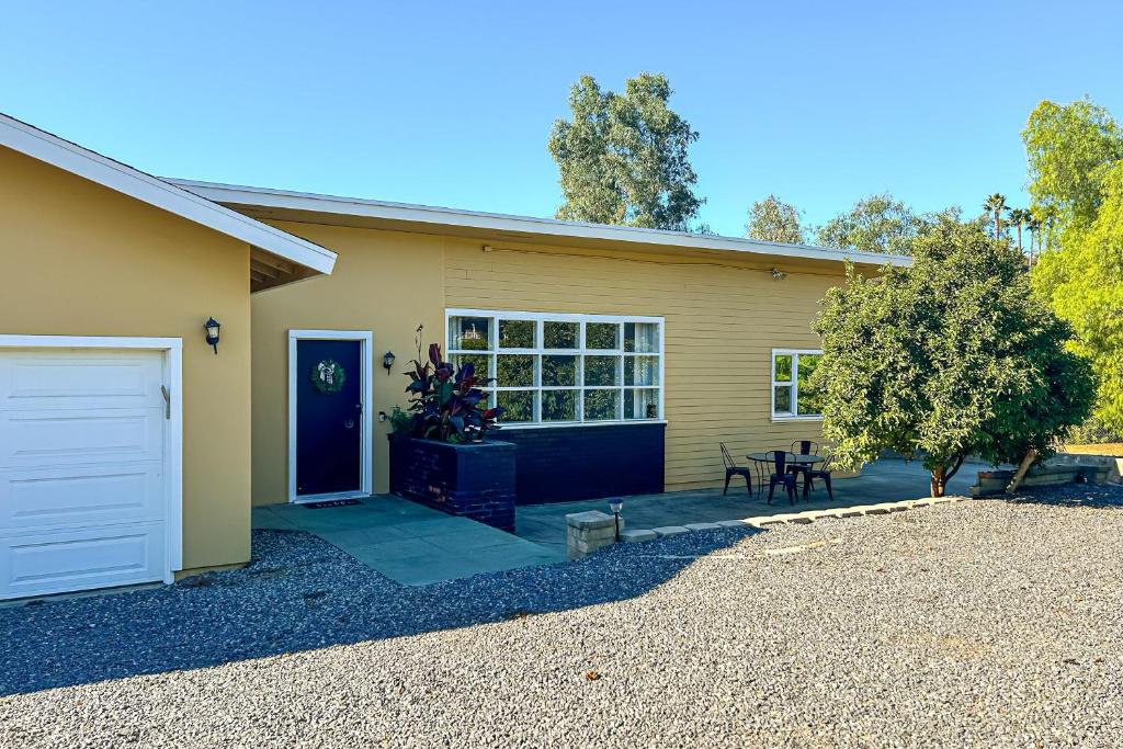 a house with a white door and a patio at Tierra De La Maracuyá in Fallbrook