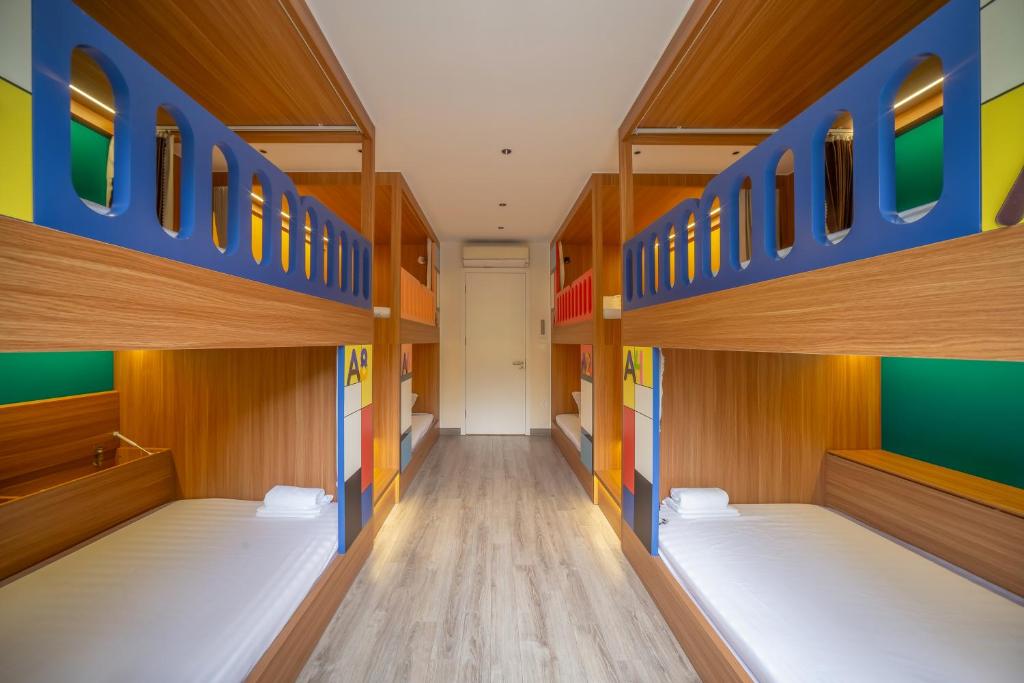a corridor of a room with bunk beds at Leng x Vuishare - Ecopark with working space in Kim Quan