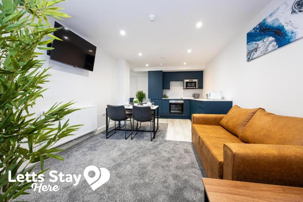 a living room with a couch and a table at Morecambe Bay Stays in Morecambe