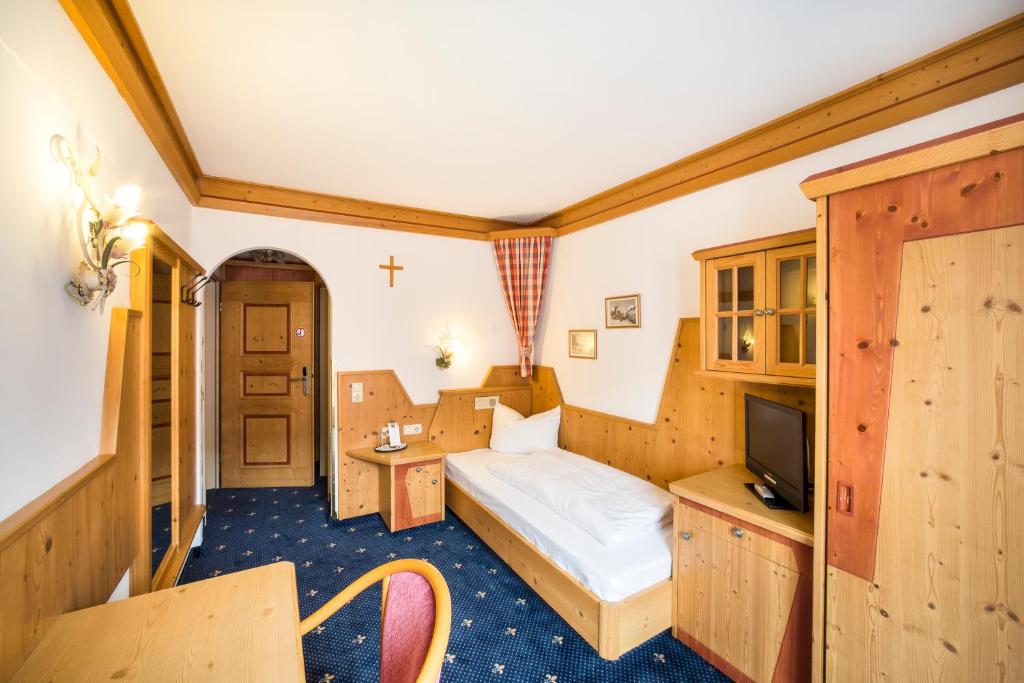 Postel nebo postele na pokoji v ubytování Hotel Hölzer Bräu by Lehmann Hotels