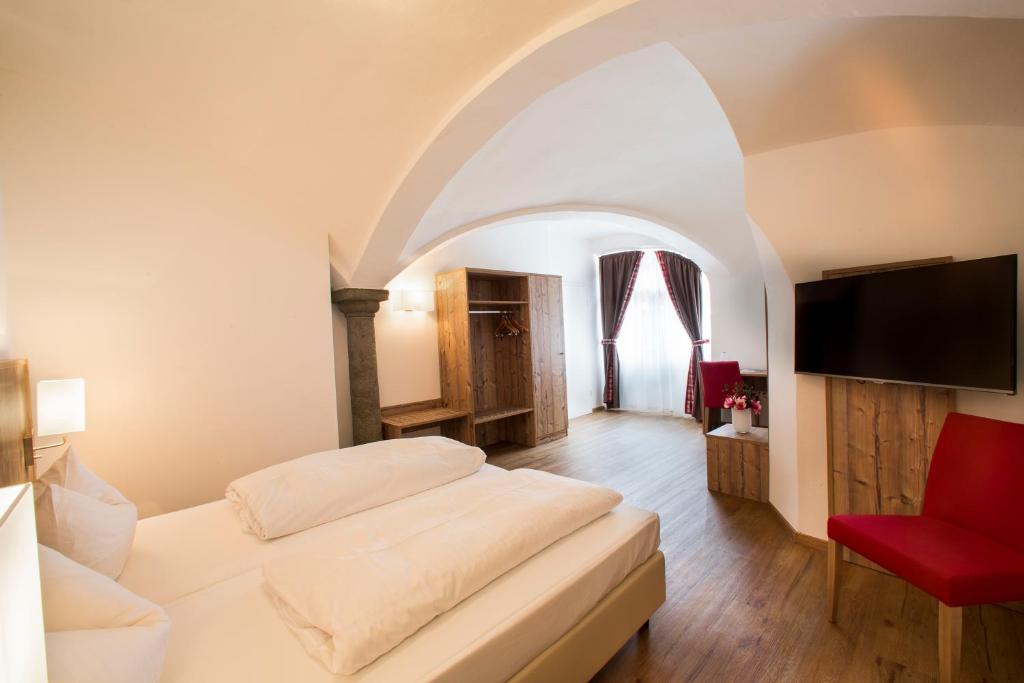 Postel nebo postele na pokoji v ubytování Hotel Hölzer Bräu by Lehmann Hotels
