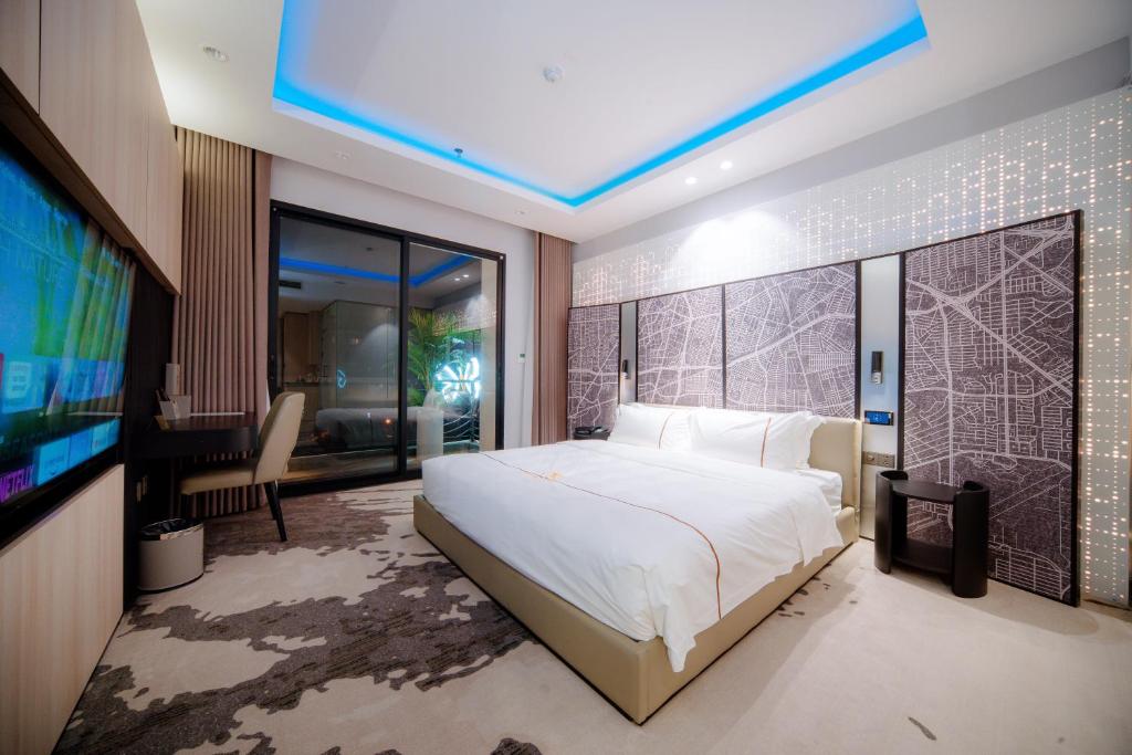 Postel nebo postele na pokoji v ubytování X-Digital HOTEL