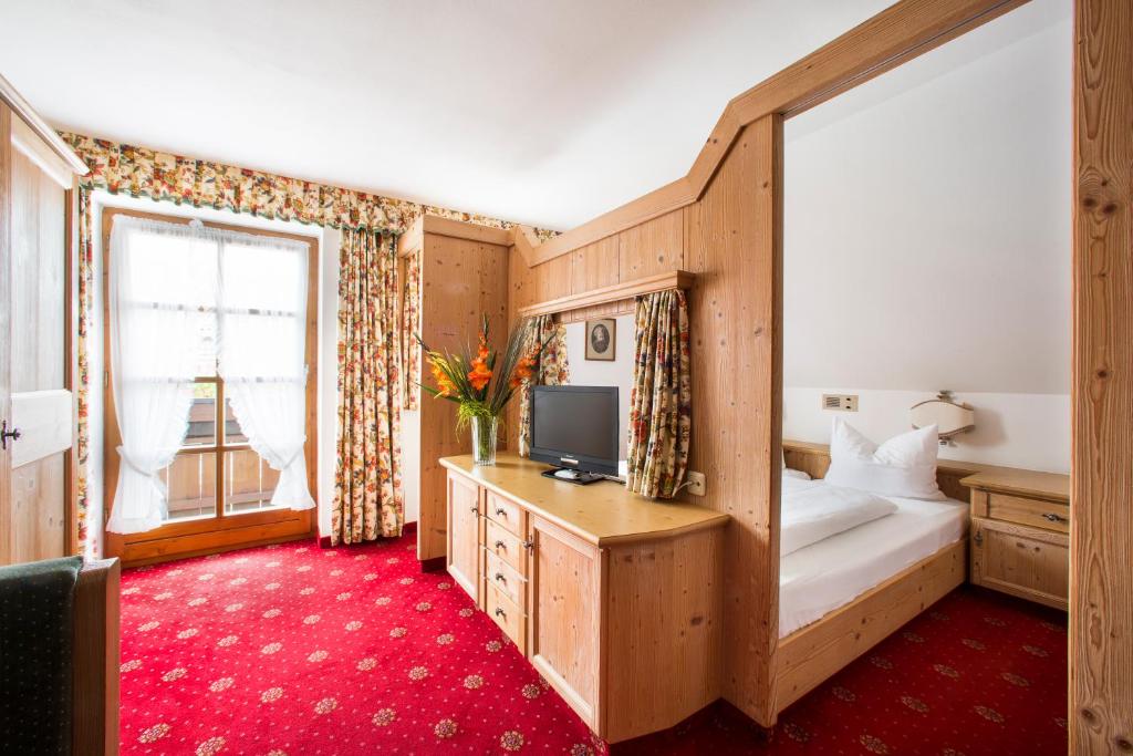 Postel nebo postele na pokoji v ubytování Hotel Hölzer Bräu by Lehmann Hotels