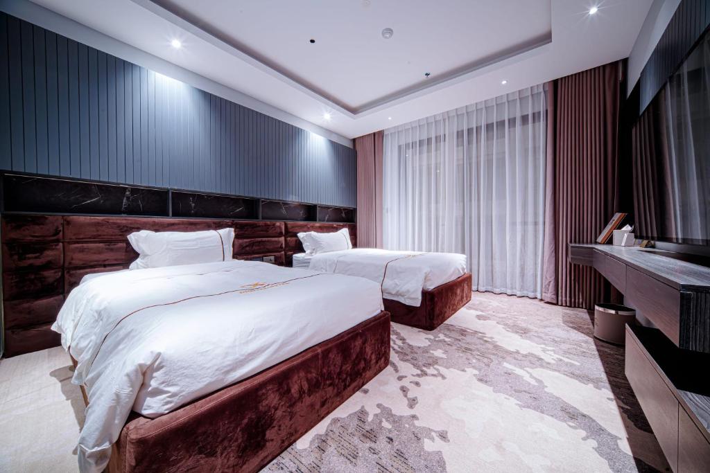 Una cama o camas en una habitación de X-Digital HOTEL