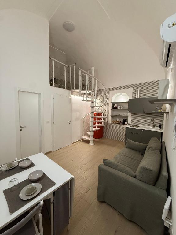 a living room with a couch and a table at The Dream Home in Vieste