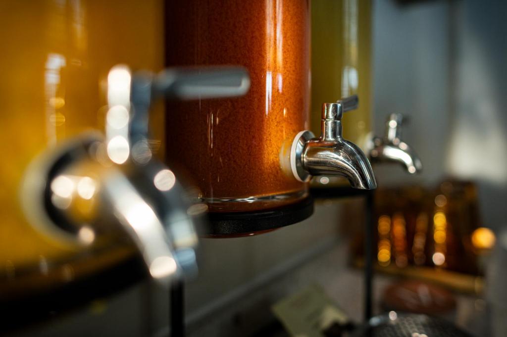 a close up of a water faucet on a sink at MÍMESIS 11 - Boutique Hotel in Como
