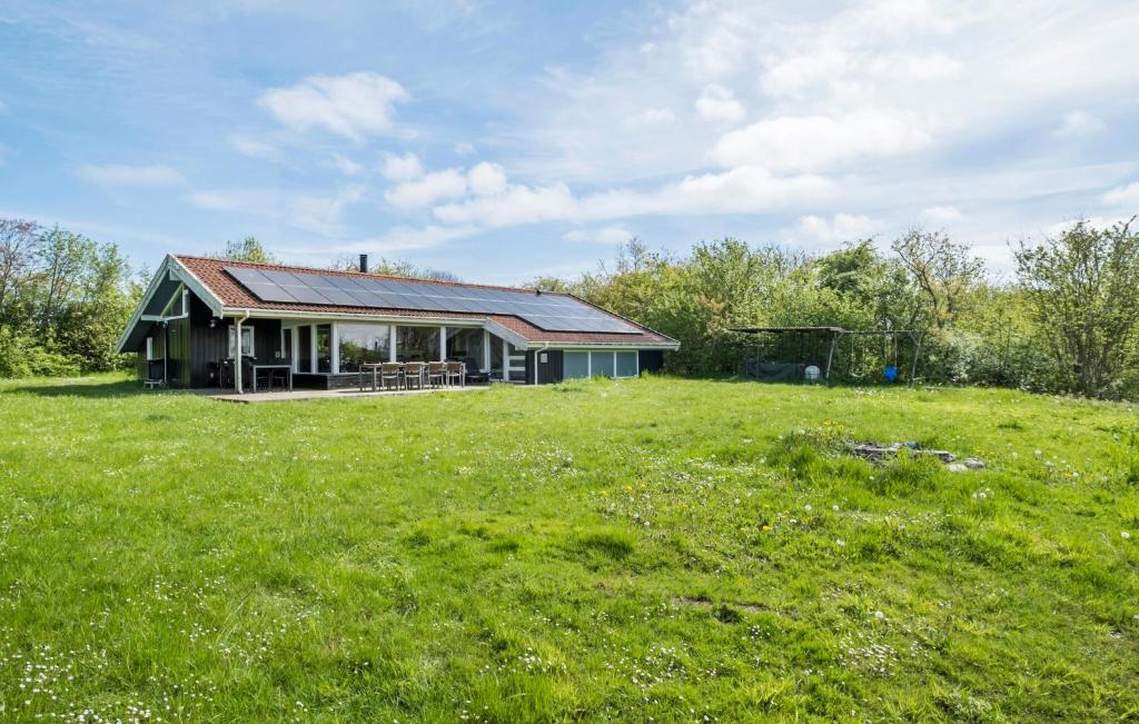 a house in a field with a grassy field at Nice Home In Sydals With Wifi in Høruphav