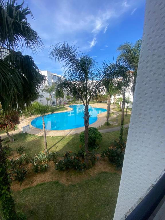 a view of a swimming pool from a apartment at Golf 47 A in Asilah