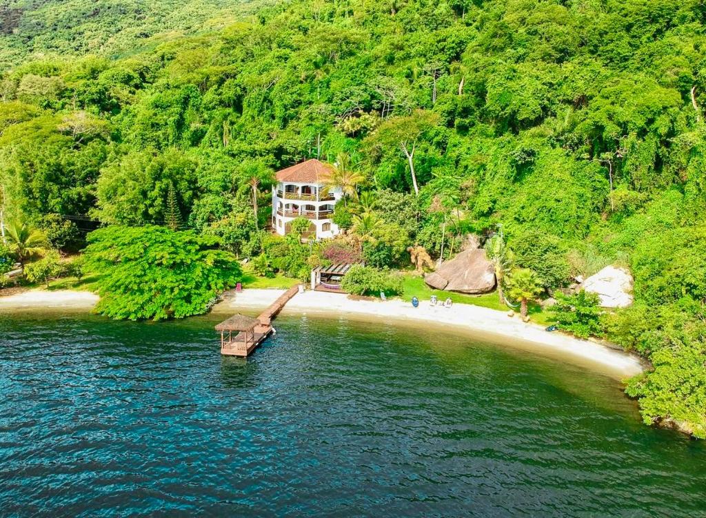 an aerial view of a house on a beach at Villa Colosseum in Florianópolis