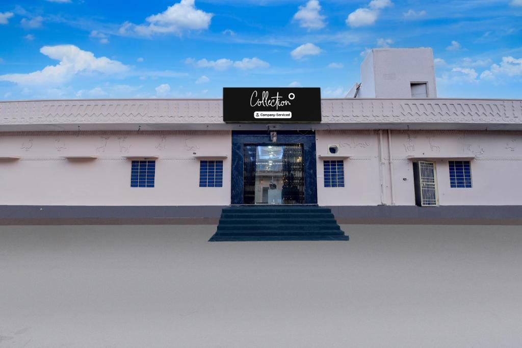 a building with a sign on the front of it at Collection O Amer Jaipur Formerly Khandaka Villa in Jaipur