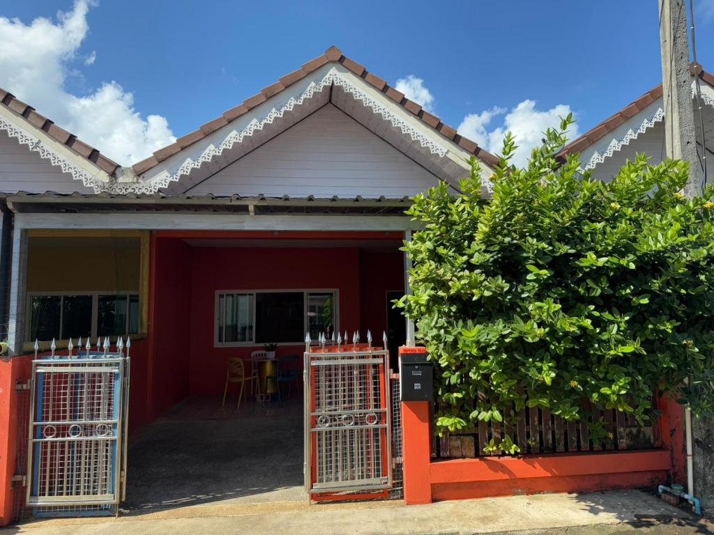 a house with a red door and a fence at Ao-Nang Private Red House 10 in Ao Nang Beach