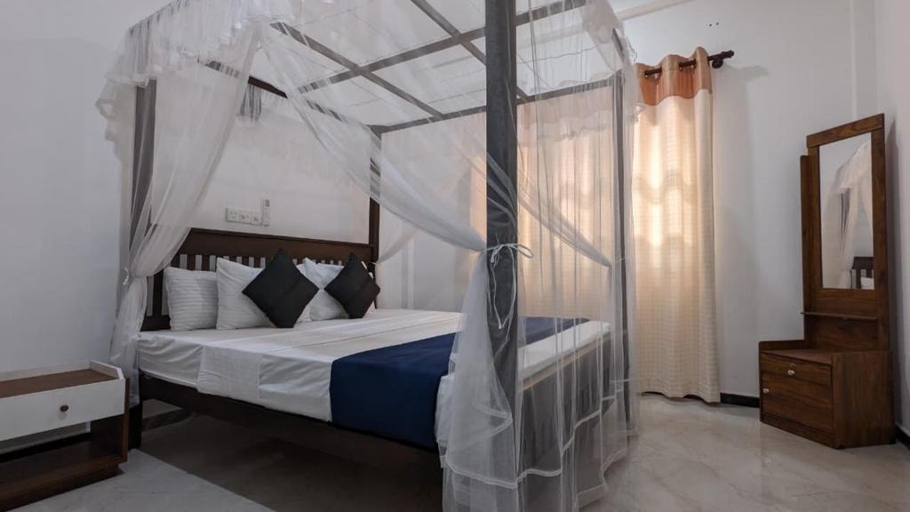 Ένα ή περισσότερα κρεβάτια σε δωμάτιο στο Echo 1 Tangalle