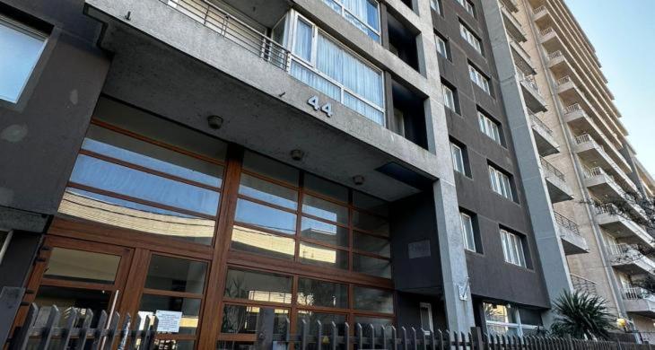 a large building with large windows and a balcony at Céntrico Departamento Edificio Civic in El Cerrillo