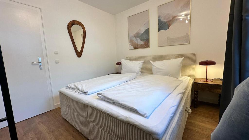 Ένα ή περισσότερα κρεβάτια σε δωμάτιο στο Casa Tantris zentral und modern mitten in Gmund