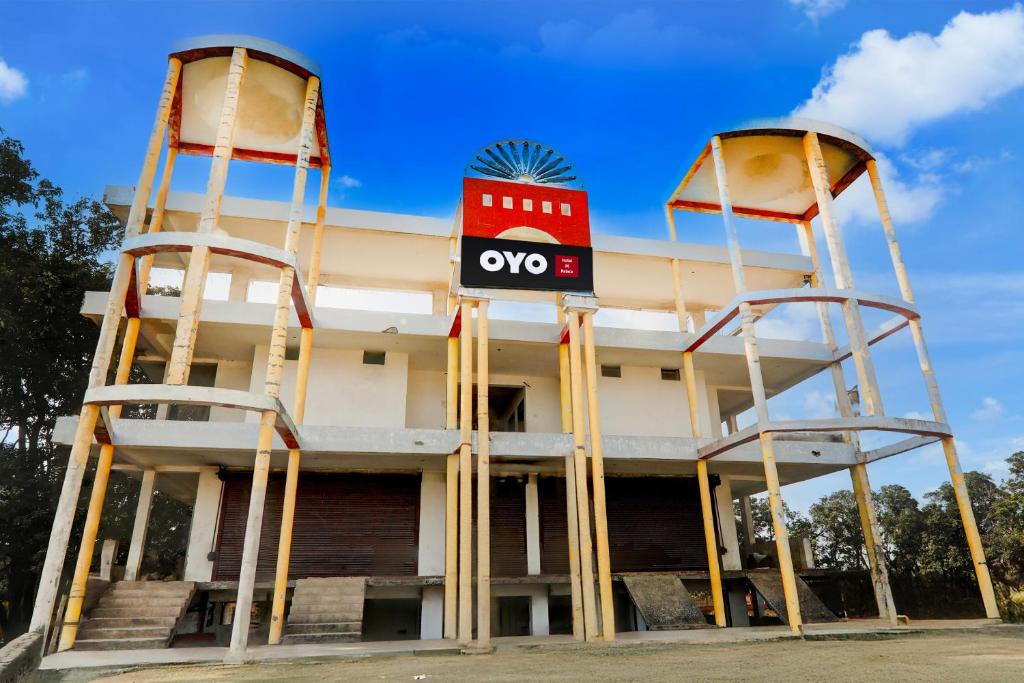 a building with two large ladders in front of it at Hotel O SK in Sītāpur