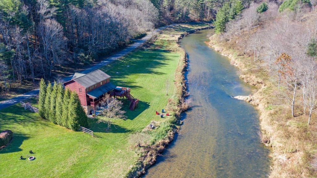 an aerial view of a house next to a river at Riverbend Retreat in Todd