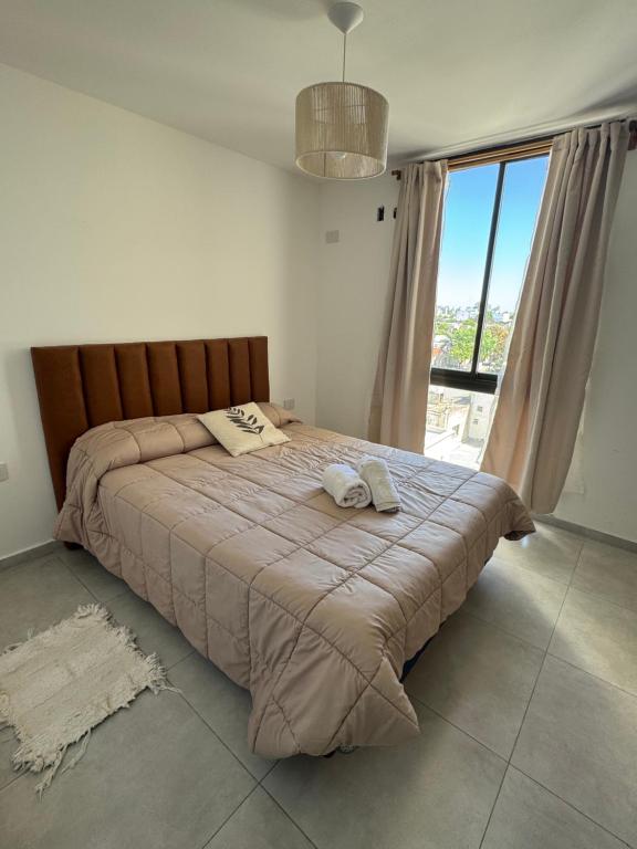 Ένα ή περισσότερα κρεβάτια σε δωμάτιο στο VILLAGE Apart - con cochera