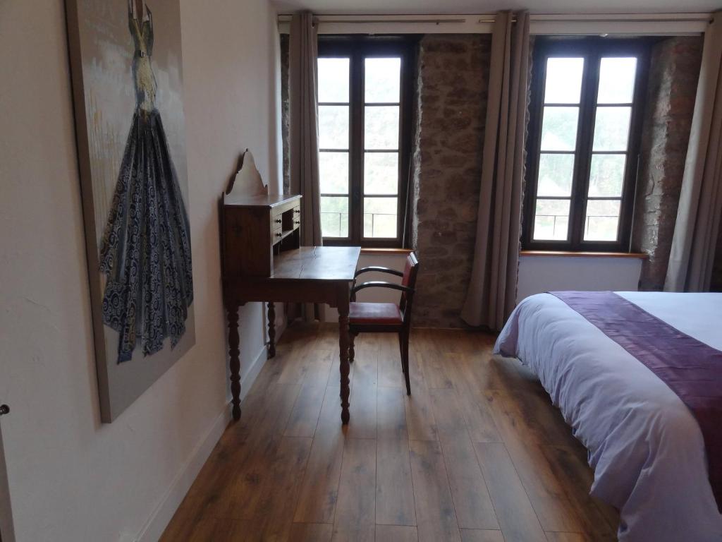 Postel nebo postele na pokoji v ubytování Gîte Dourdou - Les Hauts de Camarès