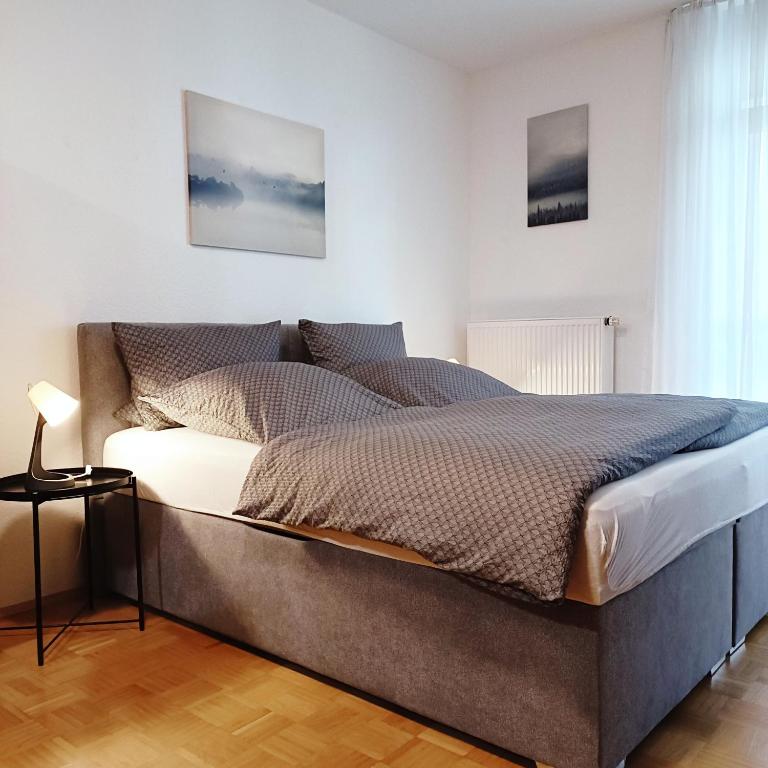 a bedroom with a large bed in a room at TauberNest in Bad Mergentheim