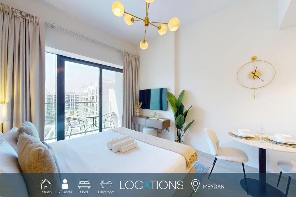 Postel nebo postele na pokoji v ubytování Locations l Luxurious Studio l Free Pool, Gym Access l Meydan