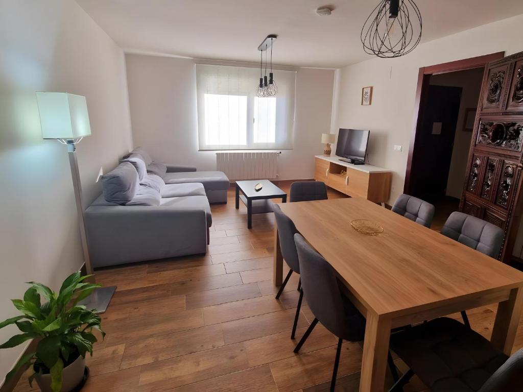 a living room with a table and a couch at Las Natillas Con V - Martín Miguel in Martín Miguel