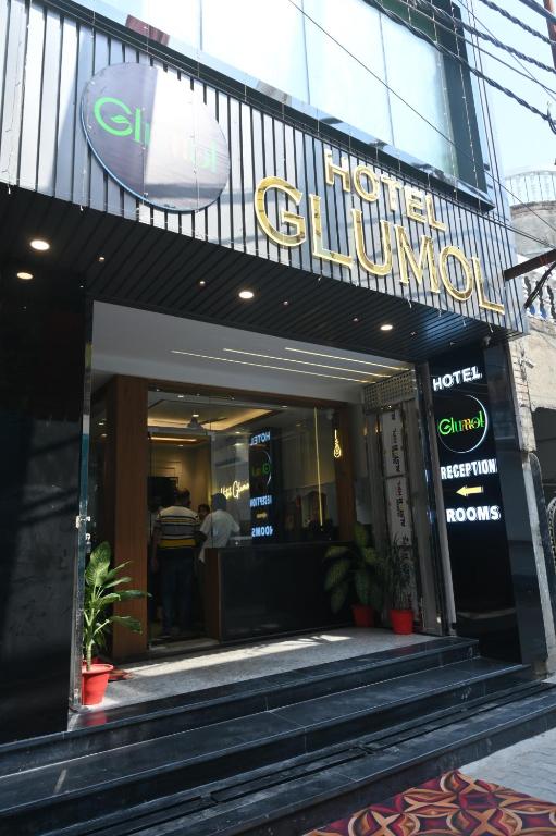 a store front of a building with a sign on it at Hotel Glumol in Roorkee