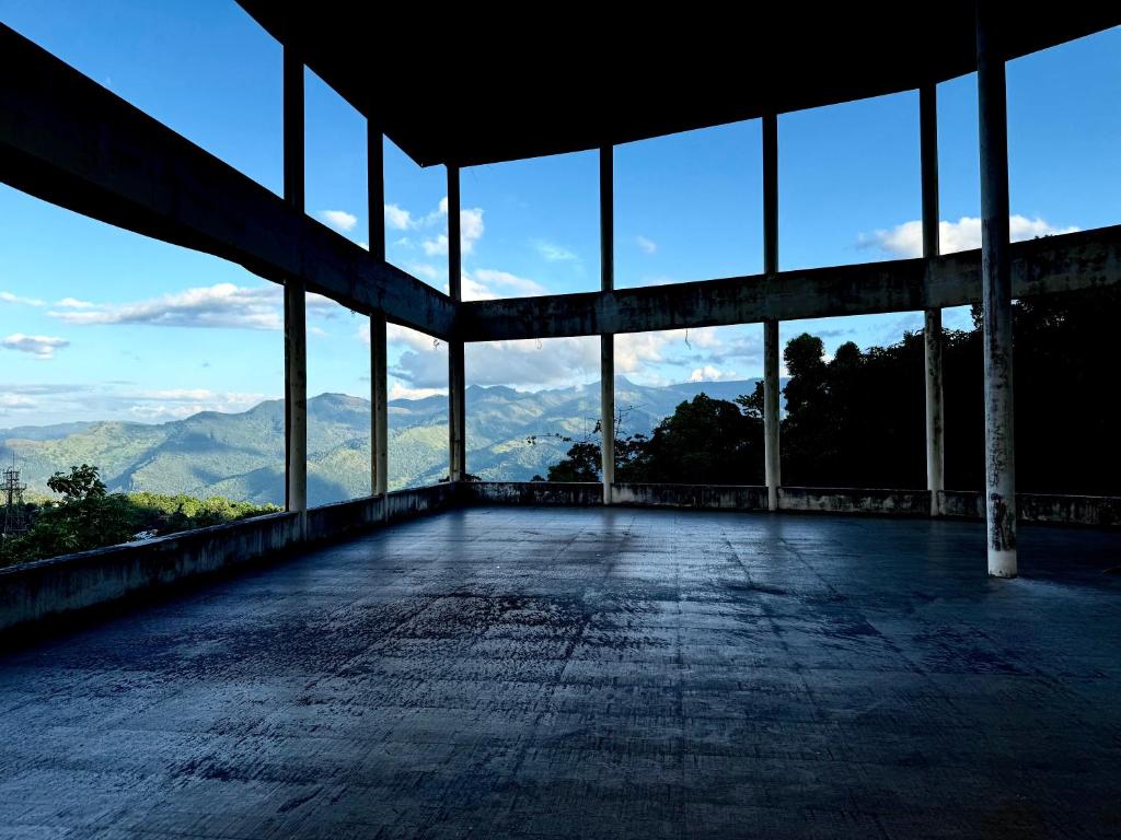 an empty building with a view of the mountains at View 240 in Rikillagaskada
