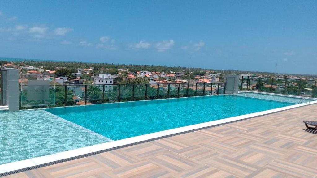 a swimming pool on the roof of a building at Ap Praia do Frances in Marechal Deodoro