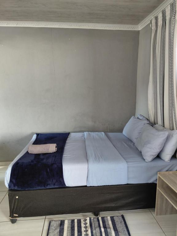 Voodi või voodid majutusasutuse Mama R's Hostel life experience toas