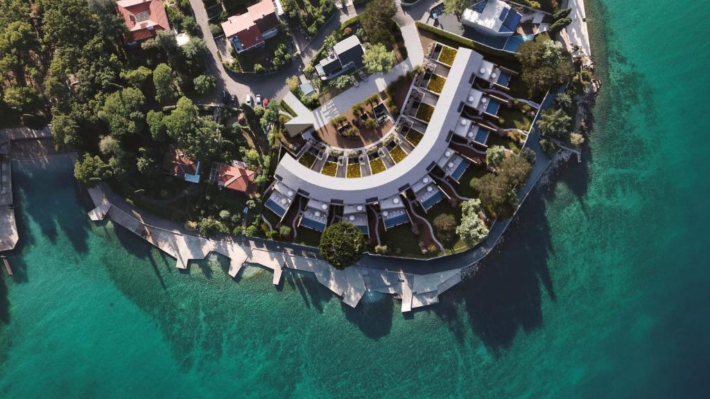 an aerial view of a house on an island in the water at HADRIE Luxury 9 Villas by the Sea in Malinska