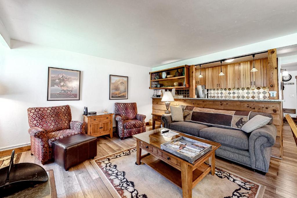 a living room with a couch and two chairs at 613 Tamarack in Moose Wilson Road