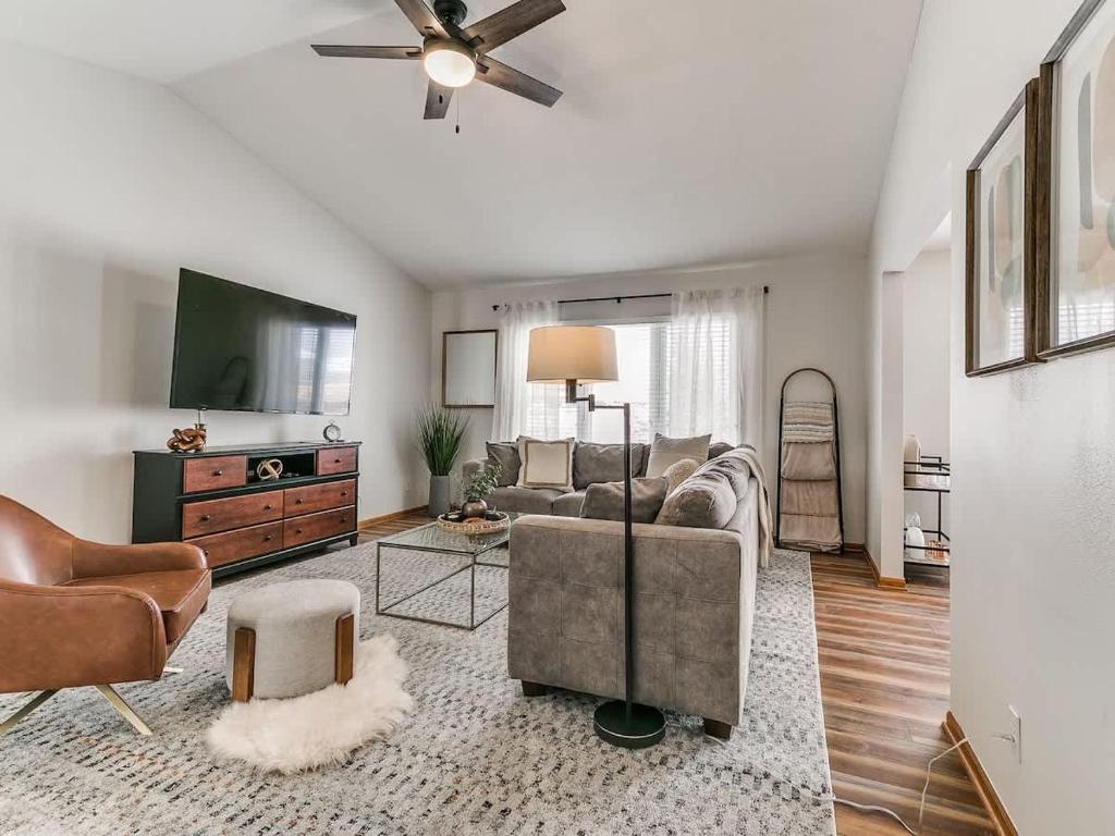 a living room with a couch and a tv at 4901 Waller in Ames