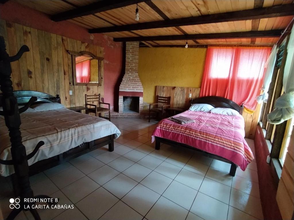 En eller flere senge i et værelse på Cabañas la garita2