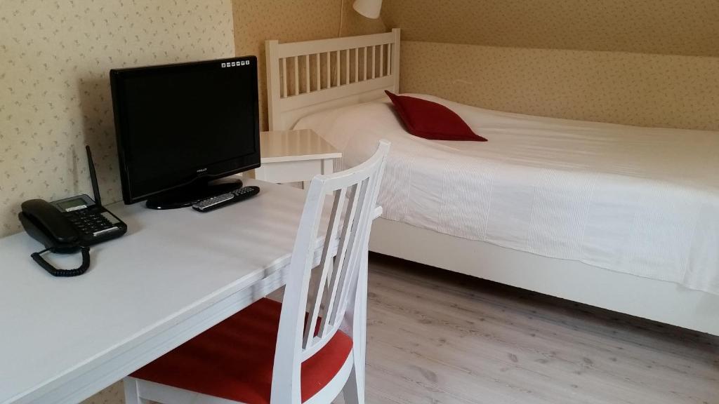 Postel nebo postele na pokoji v ubytování Lilla Hotellet