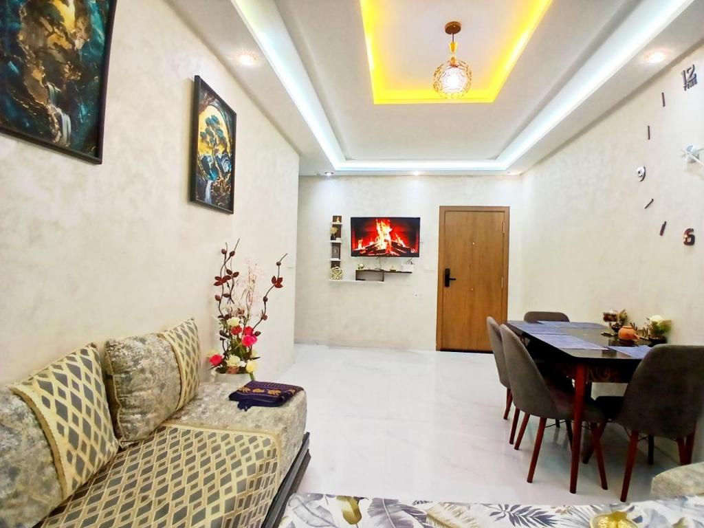 Posezení v ubytování Appartement Spacieux avec Balcon, Vue Nature, 2 Chambres et Wi-Fi Gratuit