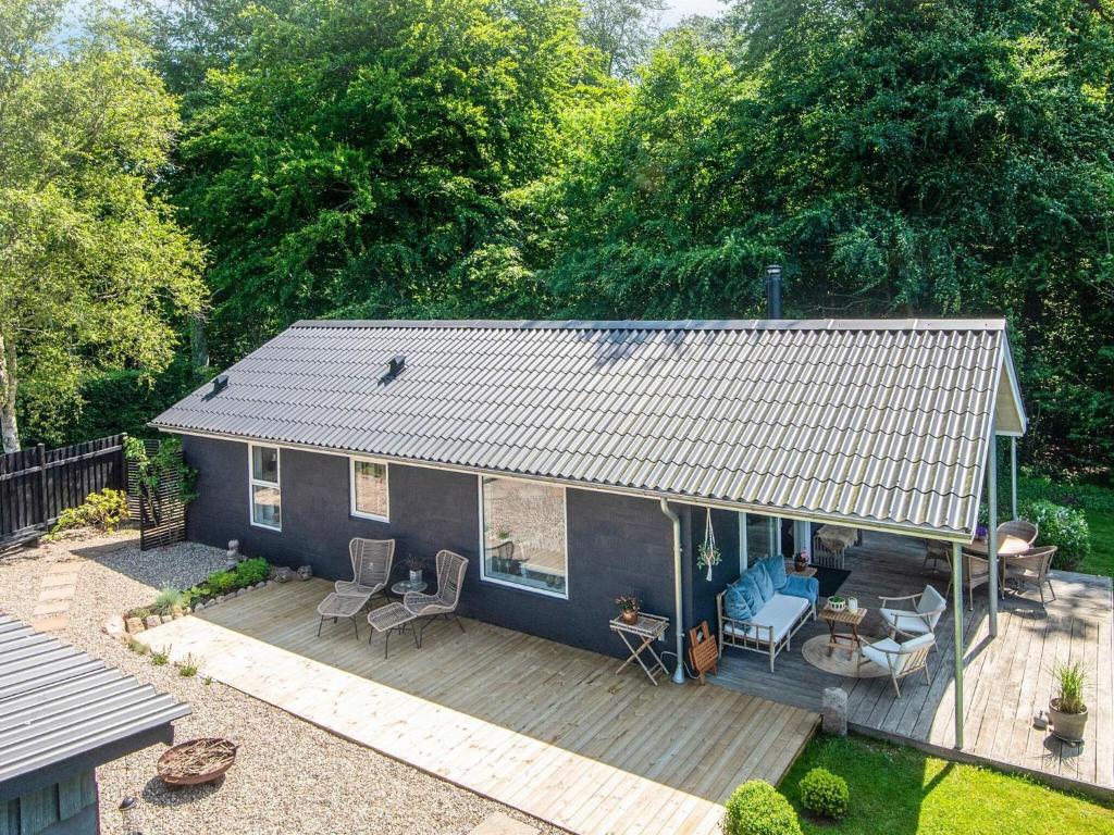 an overhead view of a blue house with a deck at Secluded Haven in Kelstrup - By Traum Ferienwohnungen in Kelstrup Strand